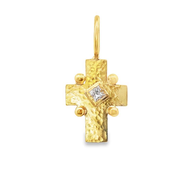 19K yellow gold cross pendant with a princess cut diamond from ELIZABETH LOCKE.