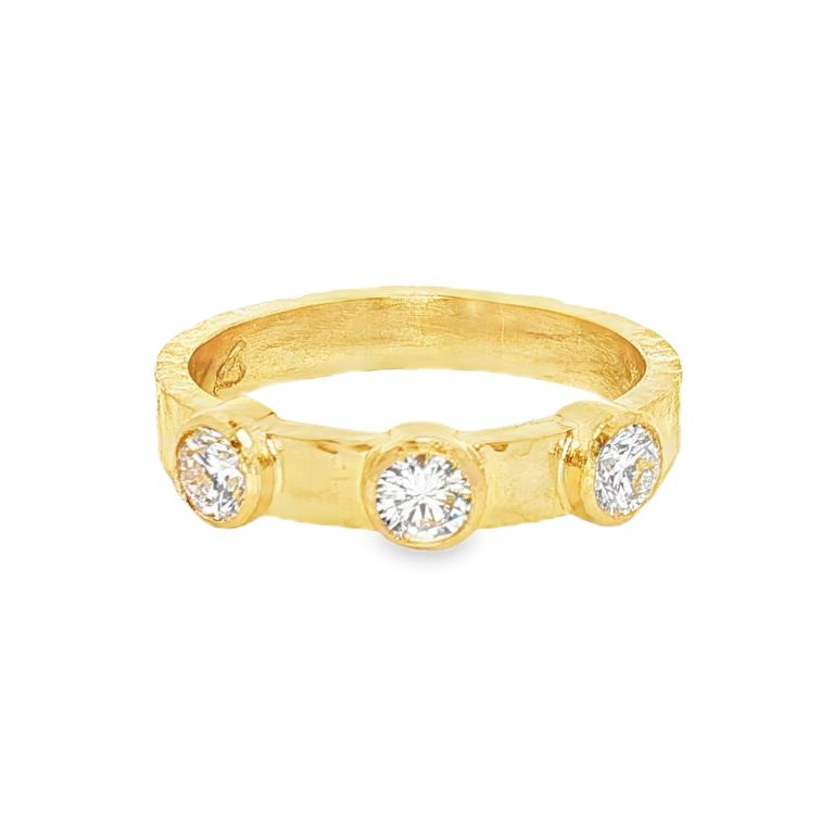 19K yellow gold diamond band set with 3 round diamonds (0.50CTW) from ELIZABETH LOCKE.