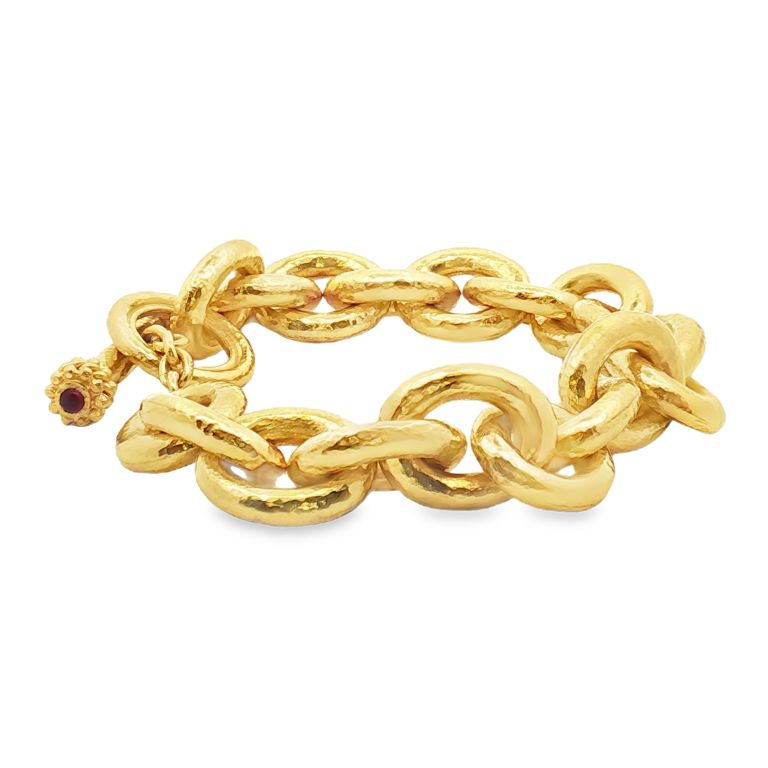 19K yellow gold oval link bracelet with 2 cabachon rubies from ELIZABETH LOCKE.