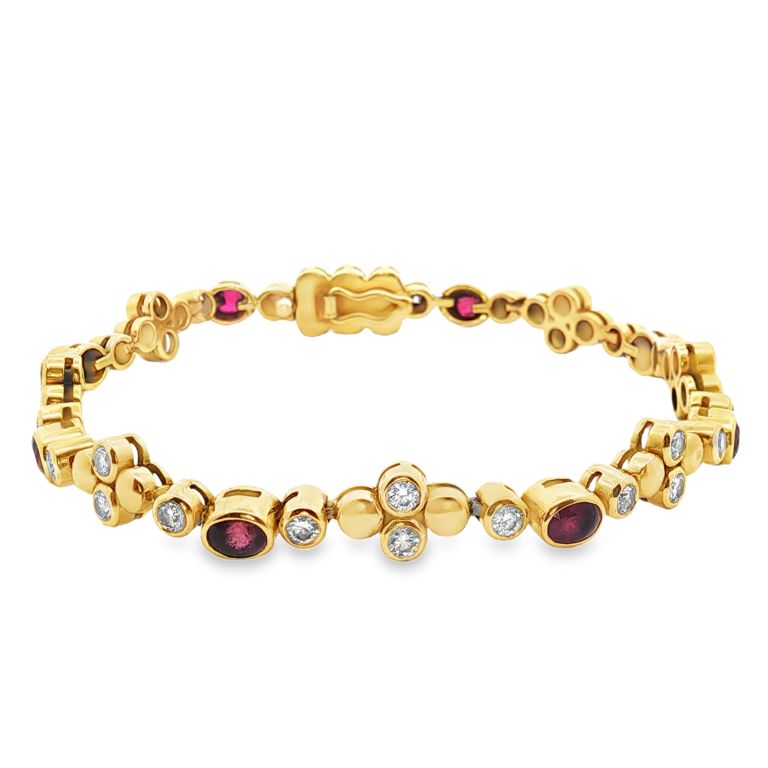 18K yellow gold diamond bracelet with 8 oval rubies (2.47ctw) and 32 round diamonds (1.53ctw)