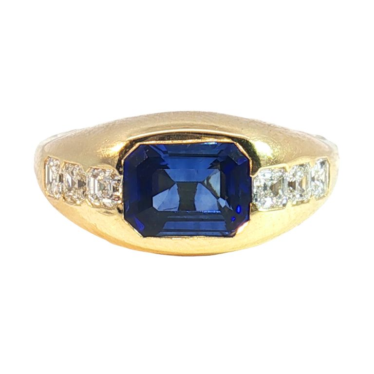 18K Yellow Gold Sapphire and Diamond Gypsy Ring set with a 1.83ct Emerald Cut Sapphire and 6 Asscher Cut Diamonds (0.60ctw)