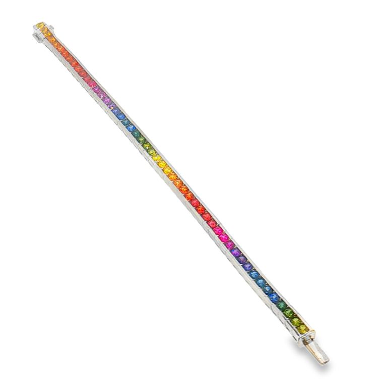 18k white gold Rainbow Sapphire bracelet set with 50 Round multicolored Sapphires (10.43ctw). Fits 7” wrist.