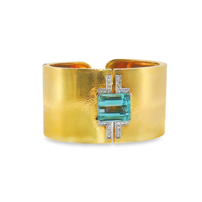 18k yellow gold David Webb Aquamarine and Diamond cuff bracelet set with one Emerald cut Aquamarine and 28 Round diamonds with a platinum hinge.