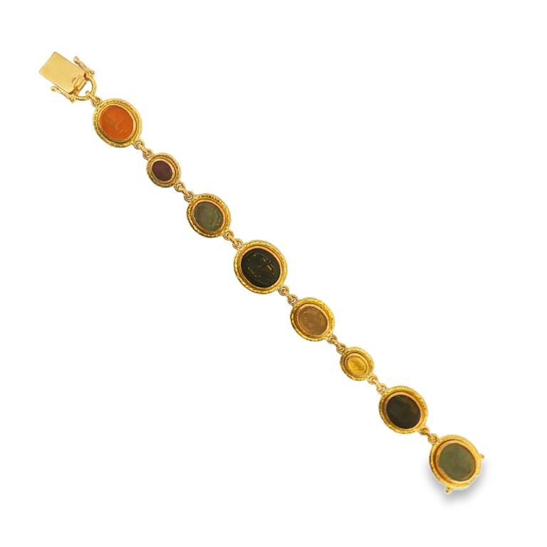 19K Yellow Gold Venetian Glass Intaglio Bracelet set with 9 different Venetian Glass Intagli on a bracelet measung 7.00" in length.