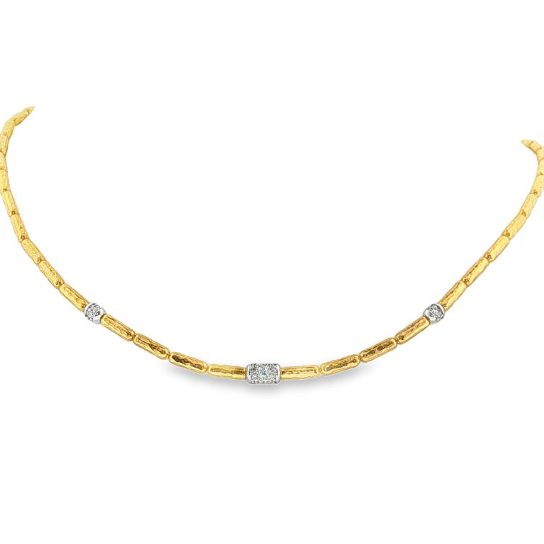24k yellow gold tubular necklace with 32 round cut diamonds set in 3 18k white gold tubular stations (.45ctw) with 18k yellow gold lobster clasp.