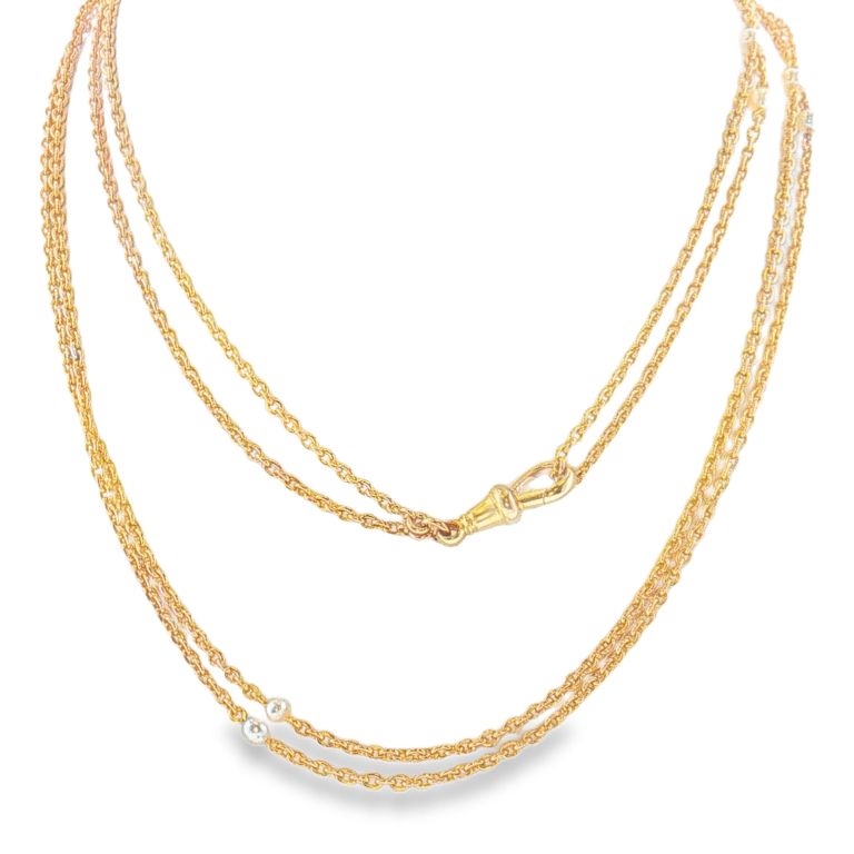 16k yellow gold pocket watch chain with 10 pearl stations with a length of 57 inches.