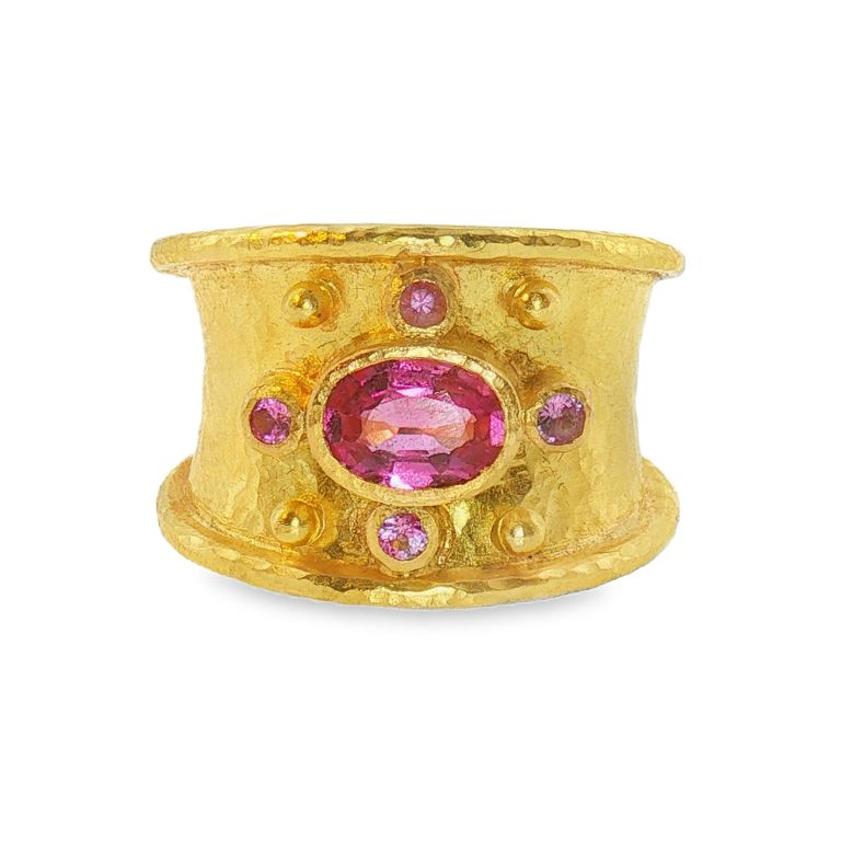 19k yellow gold ring by Elizabeth Locke set with one oval pink tourmaline (5x7mm) and four sapphires.