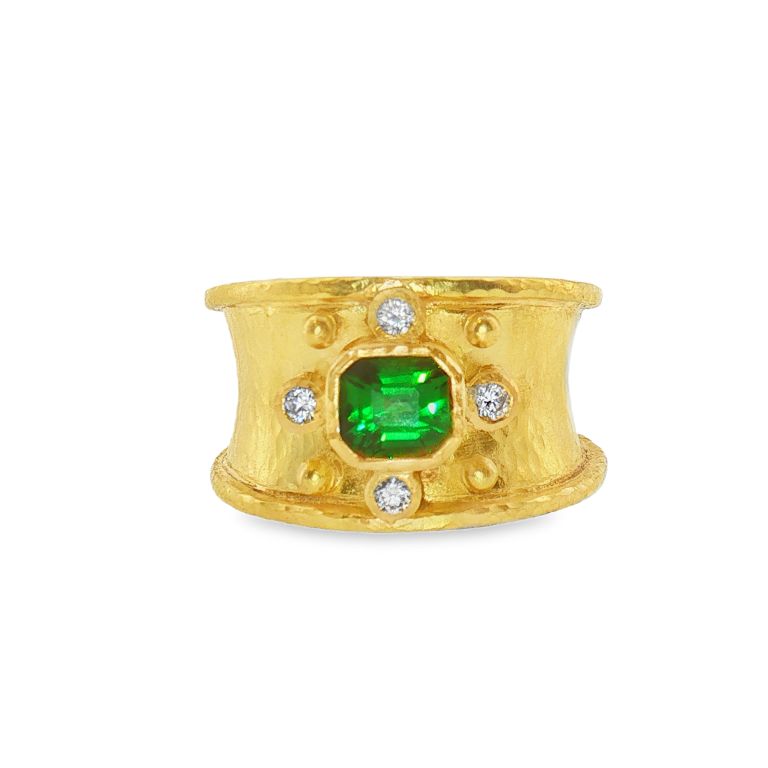 19k yellow gold ring by Elizabeth Locke set with one emerald cut tsavorite and diamonds (.12ctw).